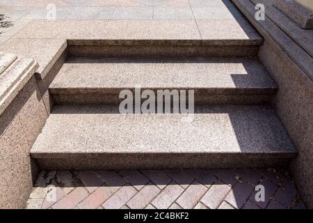 threshold with steps of marble and stone tiles, close up of the entrance lit by sunlight. Stock Photo