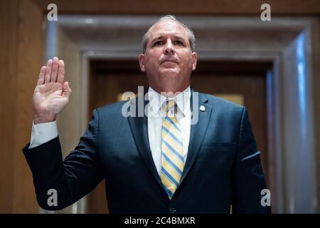 Mark A. Morgan, acting commissioner of the U.S. Customs and Border Protection, is sworn into the US Senate Homeland Security and Governmental Affairs Committee hearing titled 'CBP Oversight: Examining the Evolving Challenges Facing the Agency,' in Dirksen Senate Office Building on Thursday, June 25, 2020.Credit: Tom Williams/Pool via CNP | usage worldwide Stock Photo