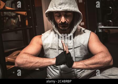 Yoga teacher sitting in the lotus position with their eyes closed. Man practicing Yoga. How to Keep Your Arms  for a Kriya or Meditation. Stock Photo