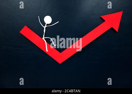 Human stick figures sliding on a red arrow pointing upward. Economy bounce back and recovery concept. Stock Photo