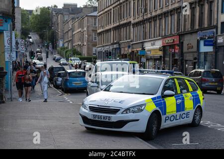 Glasgow, Scotland, UK. 25th June, 2020. Police attend in large numbers at the end of the day to clear crowds of young people from Kelvingrove Park who had spent the afternoon drinking in the sun. Credit: Richard Gass/Alamy Live News Stock Photo