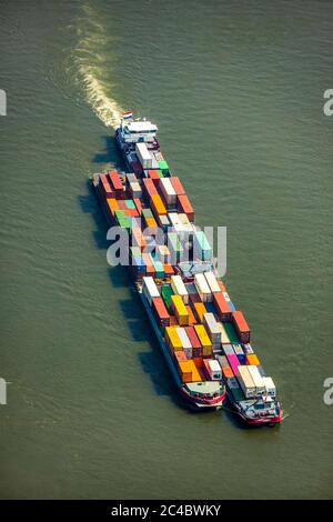 container ship on Rhine river, 07.04.2019, aerial view, Germany, North Rhine-Westphalia, Ruhr Area, Voerde Stock Photo