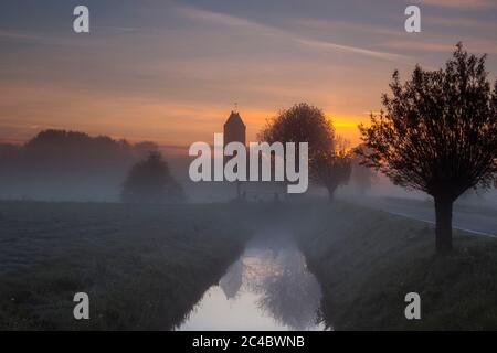 church of Swichum at sunrise, Netherlands, Frisia, Polder de Boer en Kalsbeek, Wirdum Stock Photo