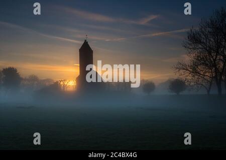 church of Swichum at sunrise, Netherlands, Frisia, Polder de Boer en Kalsbeek, Wirdum Stock Photo