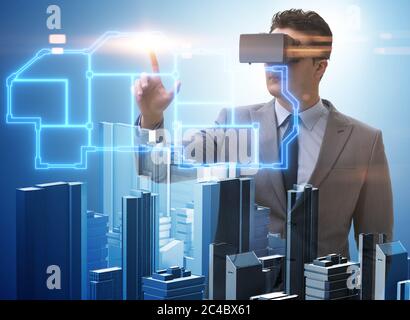 The man with virtual reality goggles doing urban planning Stock Photo