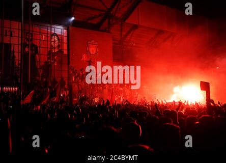 Liverpool fans let off flares outside Anfield, Liverpool. Stock Photo