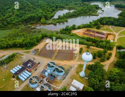 Top aerial view of purification water tanks of modern wastewater treatment processing plant Stock Photo