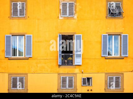 Facade of a house overlooking the Arno River in Florence, Italy Stock Photo