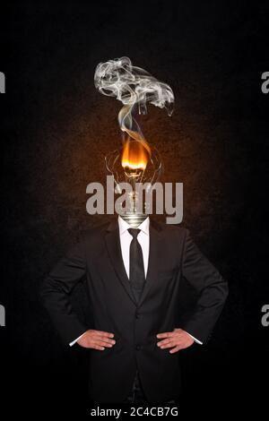 Overworked burnout business man standing headless with broken Bulb instead of his head. Symbolic Image - Stress Concept Stock Photo