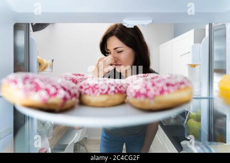 Bad Smell In Fridge. Rotten Food In Refrigerator Stock Photo