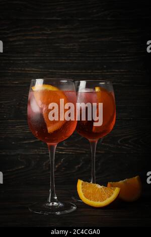 Aperol spritz cocktail on wooden background. Summer drink Stock Photo