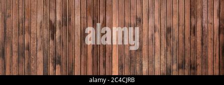 Weathered texture of a brown wooden wall - panorama Stock Photo