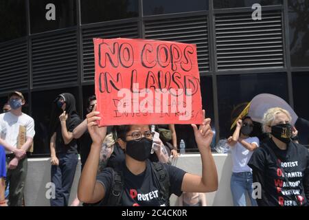 Los Angeles, United States. 23rd June, 2020. LOS AANGELES, USA. JUNE 23 2020; Demonstrators hold signs during a protest to demand the defunding of the Los Angeles school district police outside of the school board headquarters Tuesday, June 23, 2020, in Los Angeles. ( (Photo by IOS/Espa-Images) Credit: European Sports Photo Agency/Alamy Live News Stock Photo