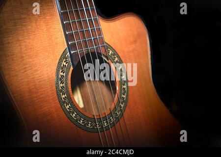 Classical guitar detail on black background Stock Photo