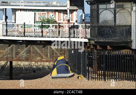 Brighton UK 26th June 2020 - Some people slept in tents overnight on Brighton beach after crowds of visitors yesterday which was the hottest day of the year so far  : Credit Simon Dack / Alamy Live News Stock Photo