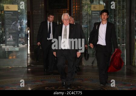 Barrister Greg James QC is surrounded by a media scrum as he leaves the Downing Centre District Court in Sydney. Stock Photo