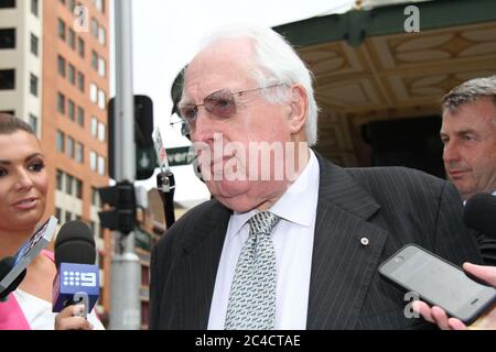 Barrister Greg James QC is surrounded by a media scrum as he leaves the Downing Centre District Court in Sydney. Stock Photo