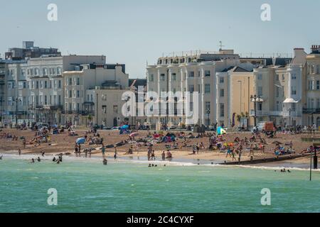 Busy beach crowds at Worthing, West Sussex, UK Stock Photo