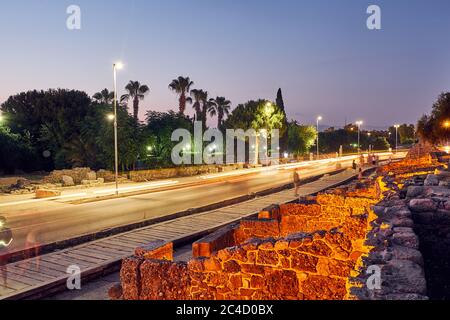 The ruins of the ancient city of Side in the evening. The modern road of Liman street Side, Turkey. The main street of ancient city Side, Turkey Stock Photo