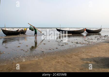 mandermoni sea beach west bengal india on may 29th 2018 : a gang of fisherman prepare to go deep sea for fishing at mandermoni sea bech west bengal in Stock Photo