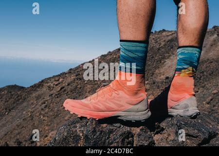 Successful runner hiker enjoy the view on mountain top cliff edge Stock Photo
