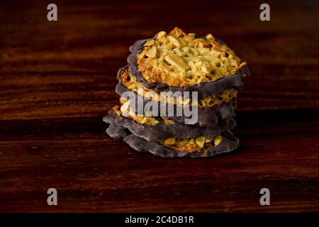 Closeup of a pile of florentine biscuits on a wooden surface Stock Photo