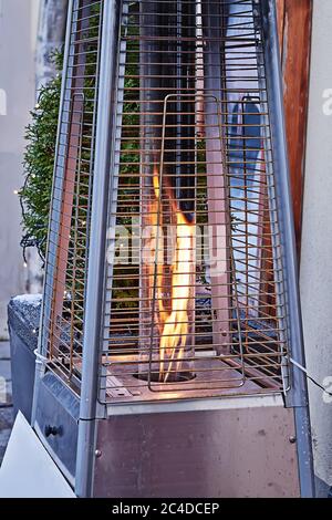 Close Up view of gas heater in outdoor terrace of street cafe Stock Photo