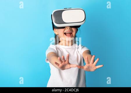 Little girl wearing virtual reality goggles at the studio Stock Photo