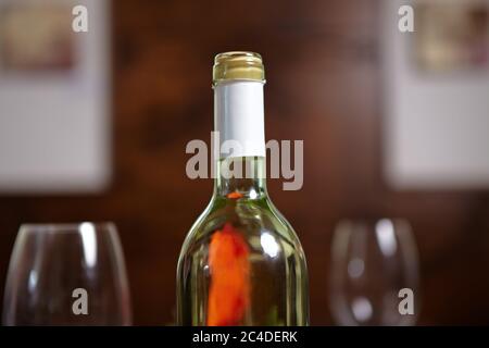 Bottle of white wine and two wine glasses in the restaurant Stock Photo