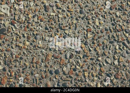 Closeup shot of a rocky cemented wall Stock Photo