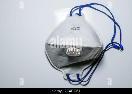 N95 mask in a white background to wear for combating COVID 19 infection Stock Photo
