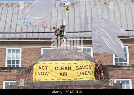 Bristol, UK. 26th June, 2020. Day two of Extinction Rebellion's occupation of the roof of City Hall in Bristol. They continue to protest about the quality of the City's air, which had improved during Covid-19 lockdown, but is now returning to its previous poor level. The protestors say they will stay on the roof until there is a commitment to for legally clean air from the council. Credit: JMF News/Alamy Live News Stock Photo