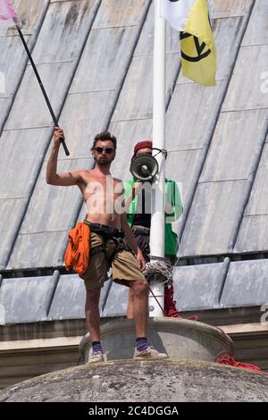 Bristol, UK. 26th June, 2020. Day two of Extinction Rebellion's occupation of the roof of City Hall in Bristol. They continue to protest about the quality of the City's air, which had improved during Covid-19 lockdown, but is now returning to its previous poor level. The protestors say they will stay on the roof until there is a commitment to for legally clean air from the council. Credit: JMF News/Alamy Live News Stock Photo