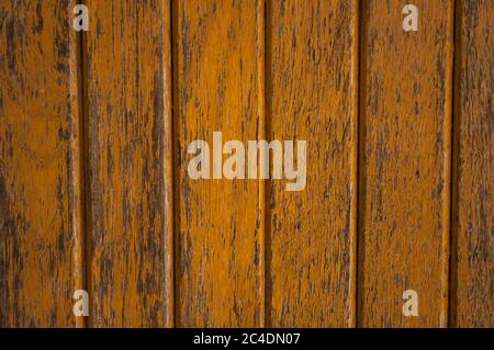 Exterior striped wood panel with dark yellow paint, texture for background or label Stock Photo