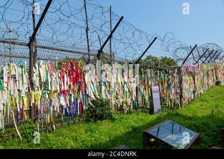Barbed wire and wish ribbons wishing for peace and unity at the DMZ, De ...