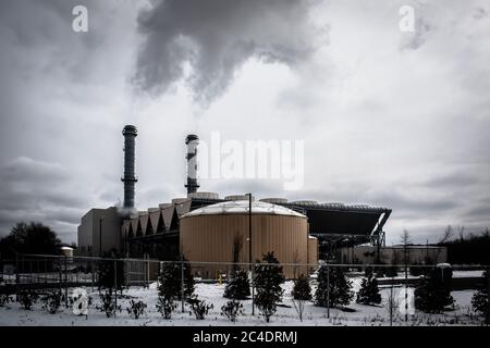 MIDDLETOWN, NY, UNITED STATES - Mar 04, 2019: CPV Valley Energy Power Plant Belching Pollution from Smoke Stacks in Ominous Dark Lighting / Negative M Stock Photo