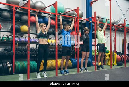 Athletes ready to do pull ups in the box Stock Photo