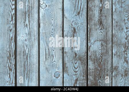 Old wooden background of brown boards with partially erased light blue paint Stock Photo