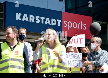 26 June 2020, North Rhine-Westphalia, Dortmund: Works councils of Galeria Karstadt Kaufhof and Karstadt Sports demonstrate the Karstadt Sports shop in the city centre. The ailing department store group had announced the closure of 62 of its 172 department stores last week. The company headquarters in Essen and the city of Dortmund have been hit particularly hard. In both cities, the remaining two department stores are to be closed. Photo: Caroline Seidel/dpa Stock Photo