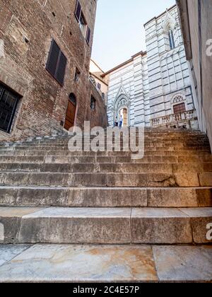 Marble steps from Piazza San Giovanni which lead to the Piazza del Duomo. Siena, Italy. Stock Photo