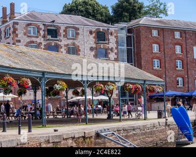 Old bonded warehouses now craft shops River Exe Exeter Quay Exeter Devon England Stock Photo