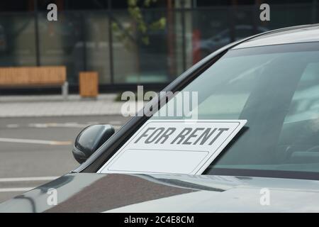 Close-up of new car with placard on the window being suggested for rent Stock Photo