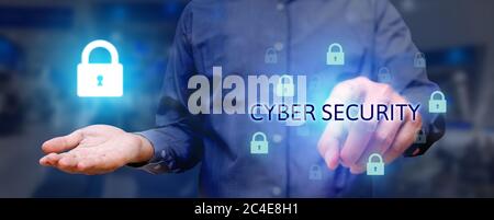 Business man poiting and pressing on button cyber security button on virtual screens with holding lock icon on hand. Stock Photo