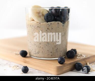 banana and blueberry topped overnight oats Stock Photo