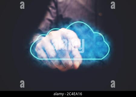 Businessman pressing cloud computing icon with vitual screen. Stock Photo