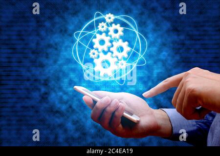 Industry 4.0, industrial internet of things concept with man using smart phone and binary background. Stock Photo