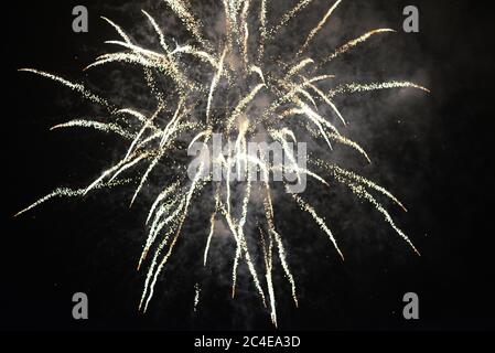 Photo of a bright colored fireworks on a black sky Stock Photo