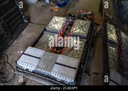 Disassembled battery of electric car. High voltage battery from an vehicle Nissan Leaf. Green energy concept. Service station. May, 2019. Kiev Stock Photo