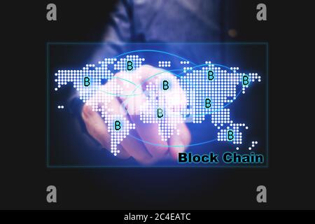 Block chain concept with businessman pointing map network on virtual screen. Stock Photo