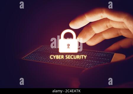 Cyber security concept, hand man protection smartphone with lock icon and virtual screen. Stock Photo